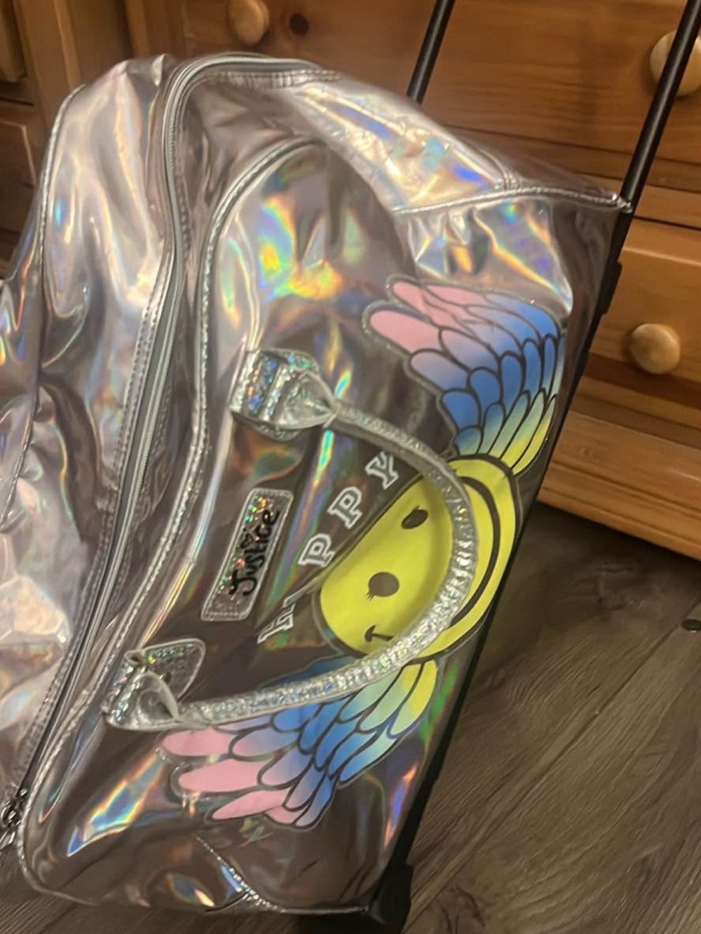 Justice Iridescent Silver Rolling Travel Bag with Yellow Smiley and Pastel Wings
